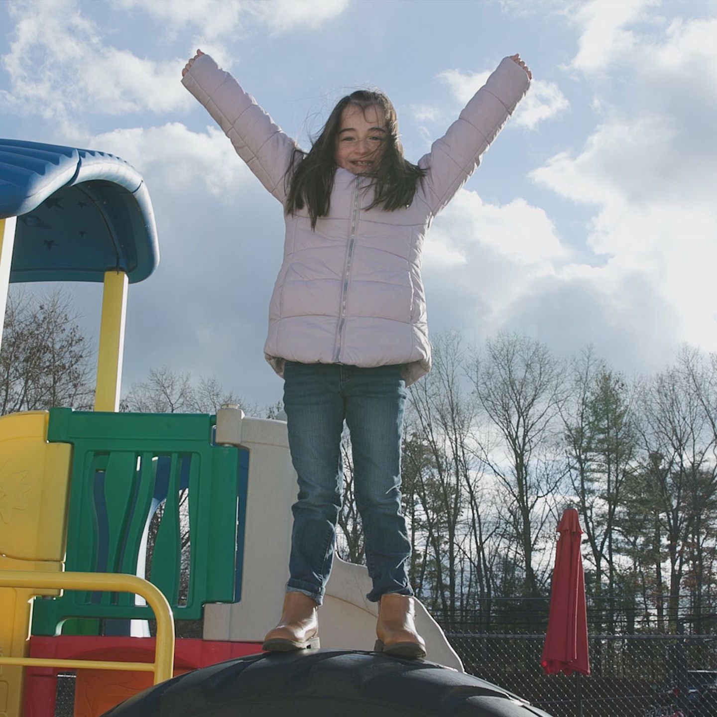 Adelyn with arms up